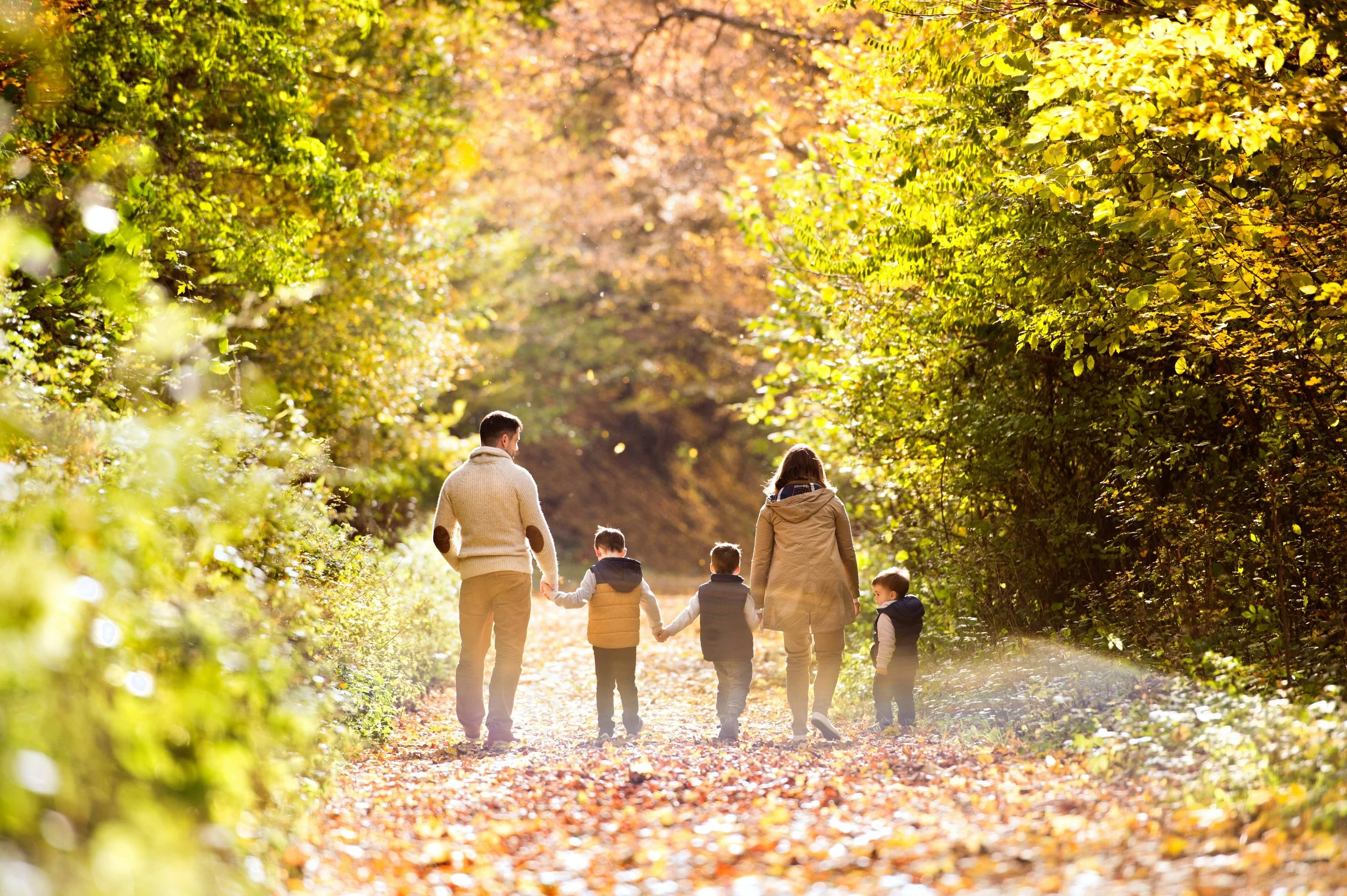Parents and children walking on a quiet path, illustrating a parenting fitness evaluation