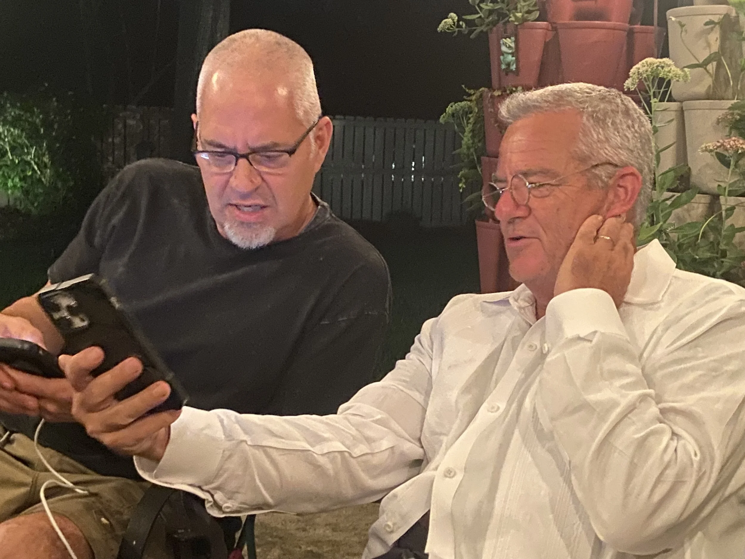 William G Gill with Jason May as he witnesses Jason's work on his iPhone