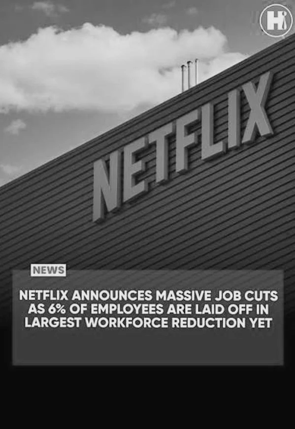 Netflix headquarters sign with a news headline about Netflix laying off 6% of employees
