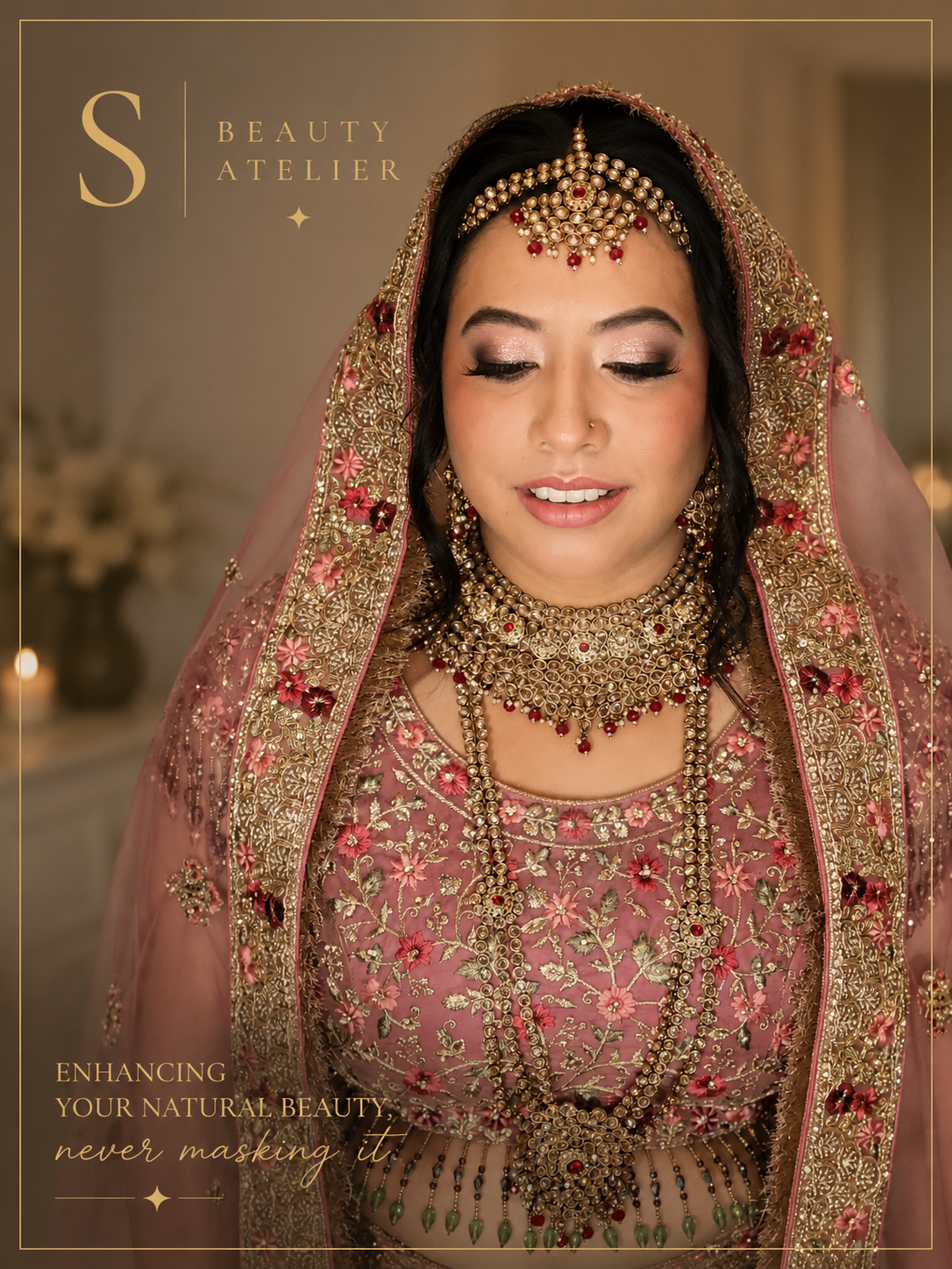 A woman dressed in a pink and gold traditional wedding outfit, adorned with jewelry and a head covering, with eyes closed and a gentle smile.