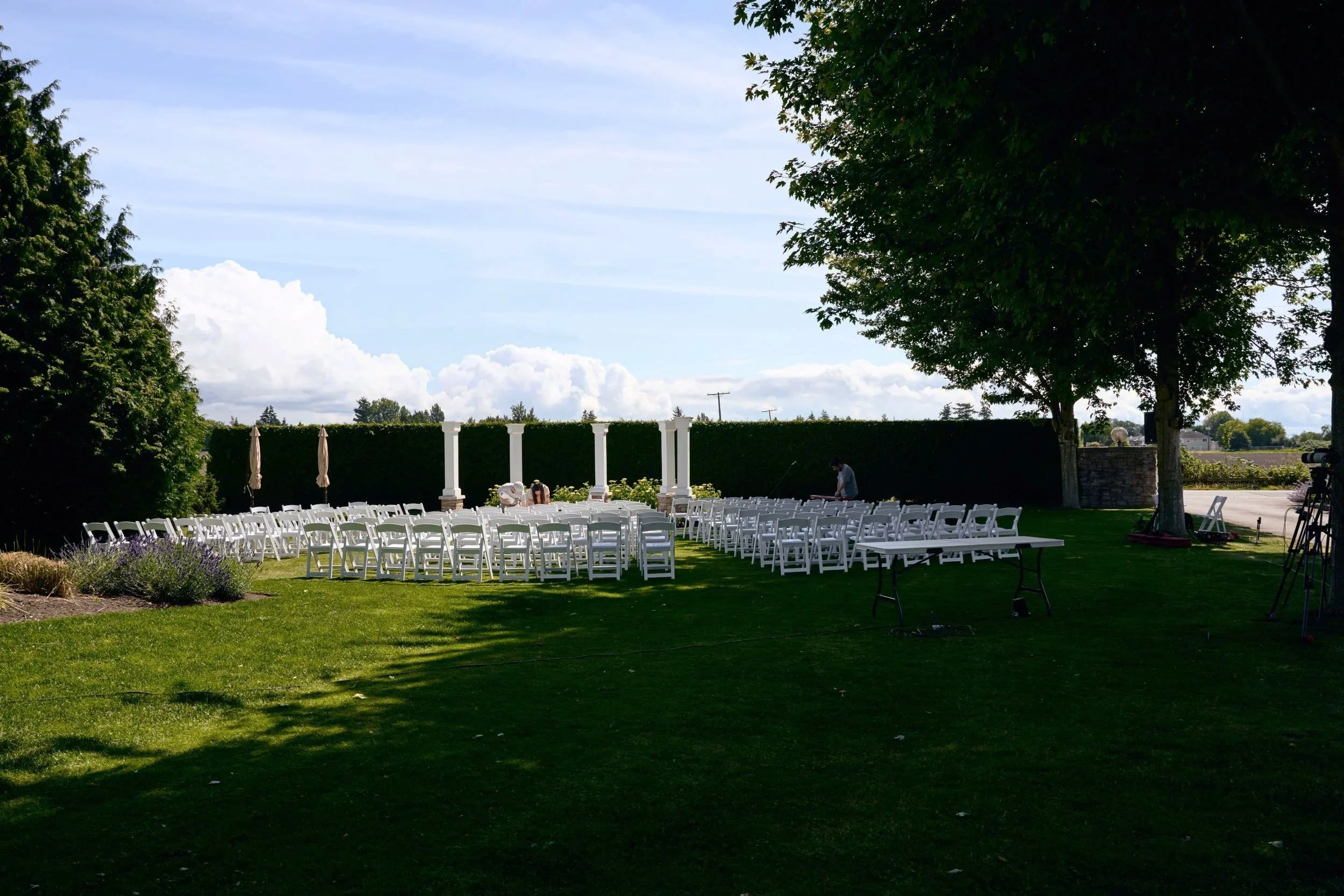 Ceremony Lawn with wedding chairs set up. Please note that the photographer has digitally removed the power lines during post-production.
