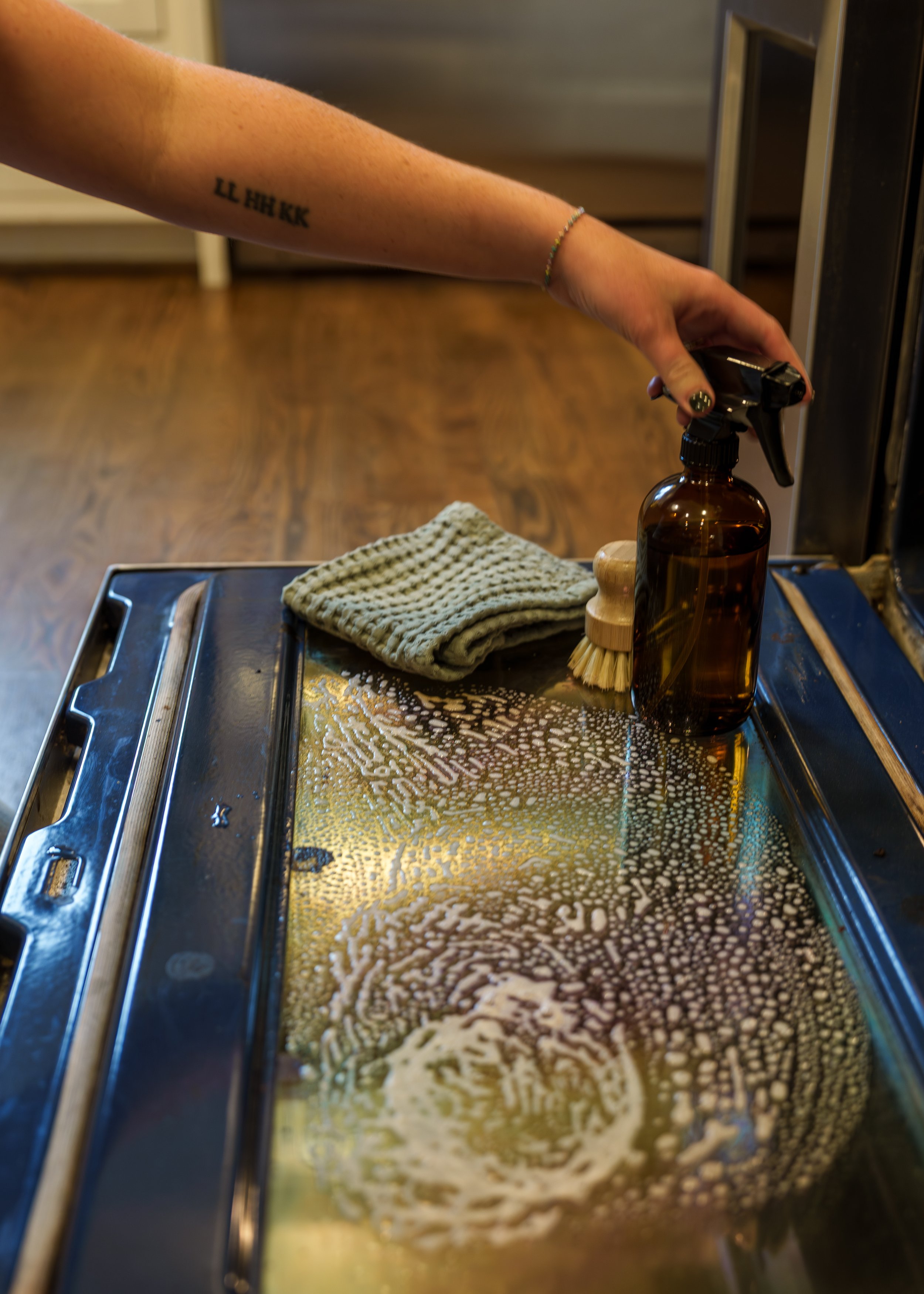 Deep cleaning an oven with non-toxic cleaning products in a Birmingham home.