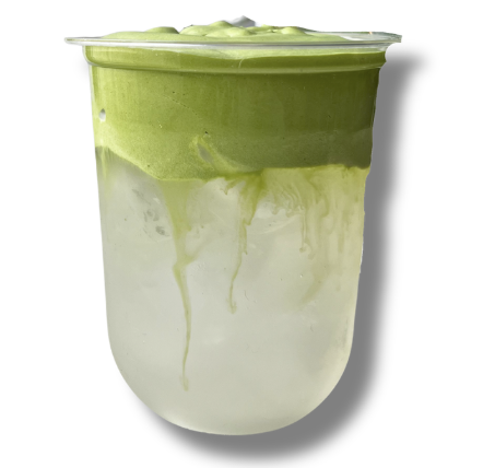 A clear plastic cup filled with a layered matcha latte, with green tea on top and milk at the bottom.