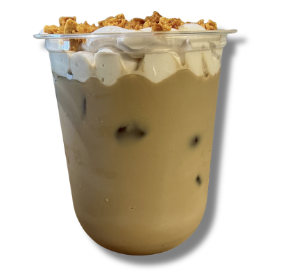 Cup of iced coffee with whipped cream and caramel topping.