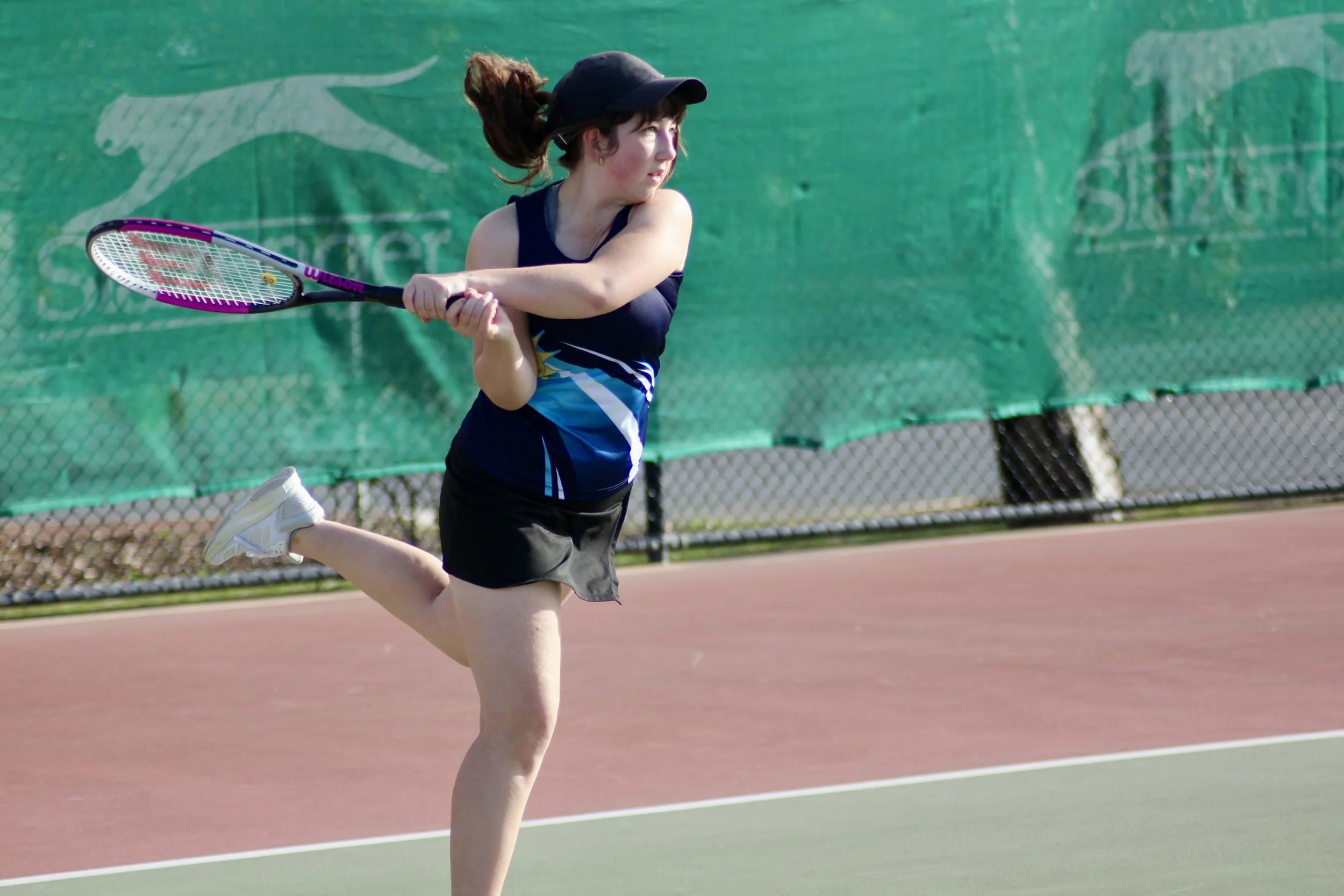 Club member playing competitive tennis at Seacliff Tennis Club in Adelaide, South Australia.