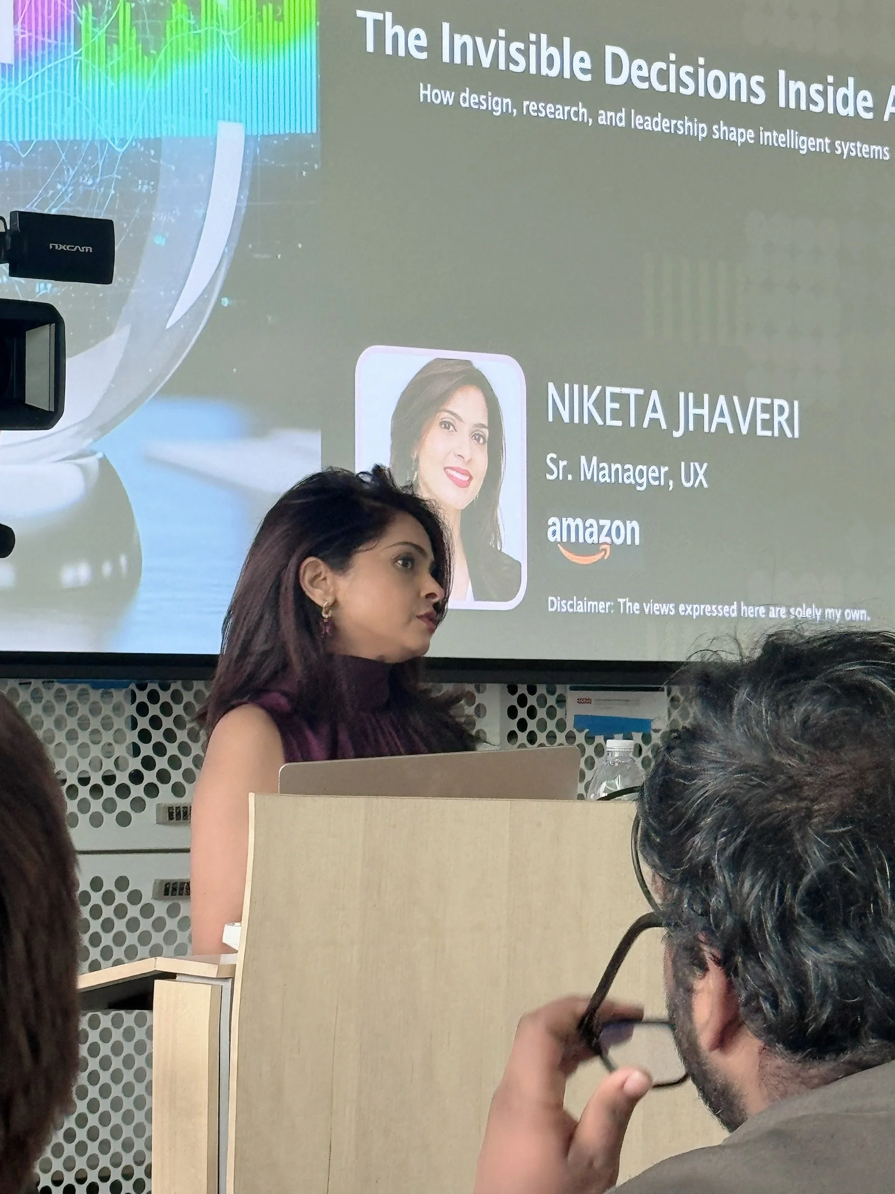 Presentation slide for “The Invisible Decisions Inside AI,” a keynote by Niketa Jhaveri on AI, design leadership, research, and human judgment.