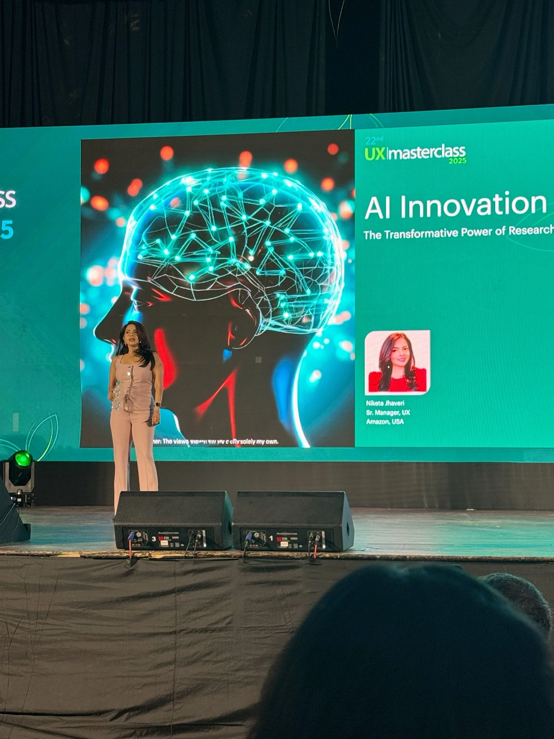 Niketa Jhaveri delivering a keynote on AI innovation and human-centered design at an international conference.
