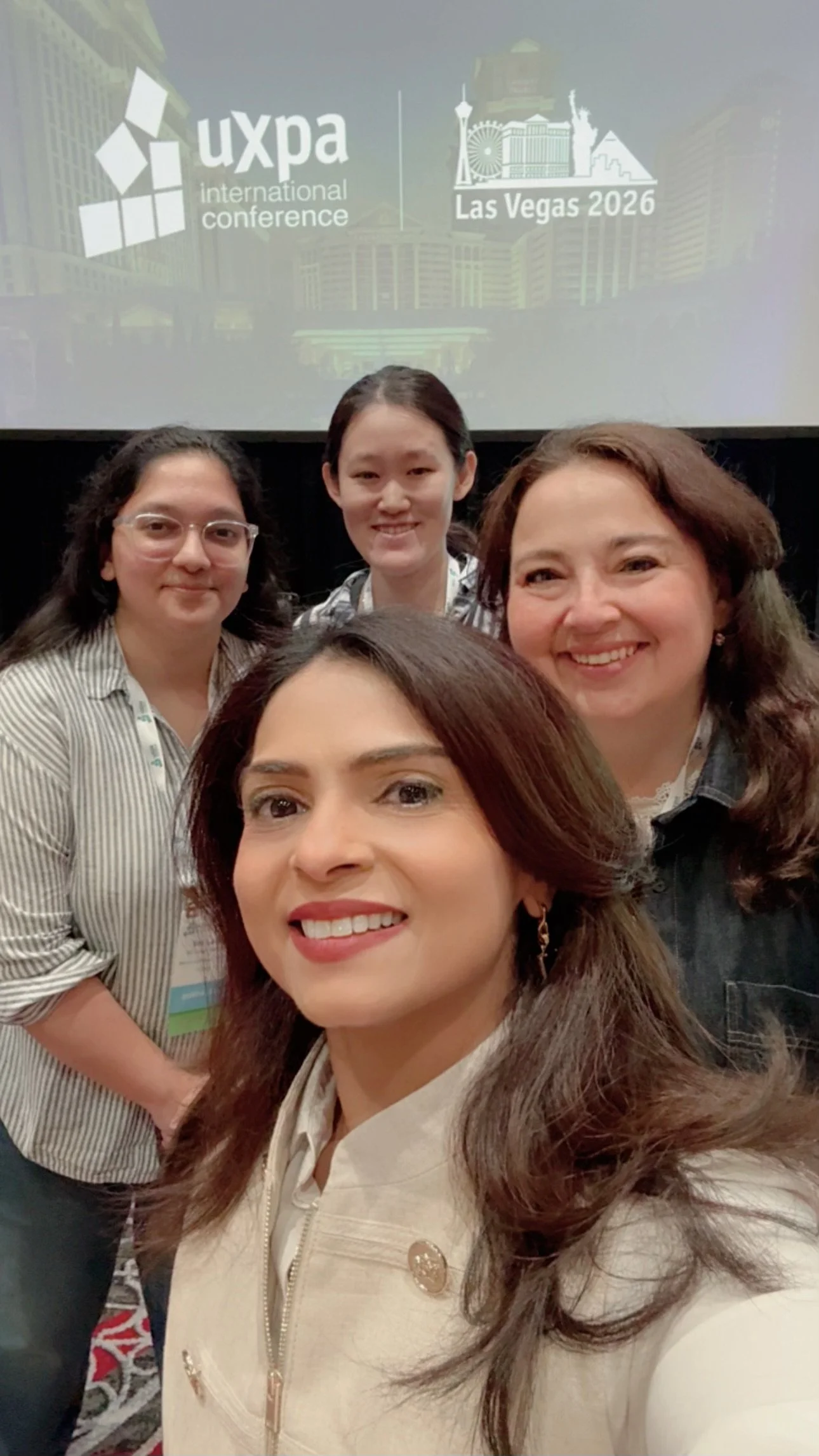Niketa Jhaveri with UX professionals at UXPA International, celebrating community and collaboration.