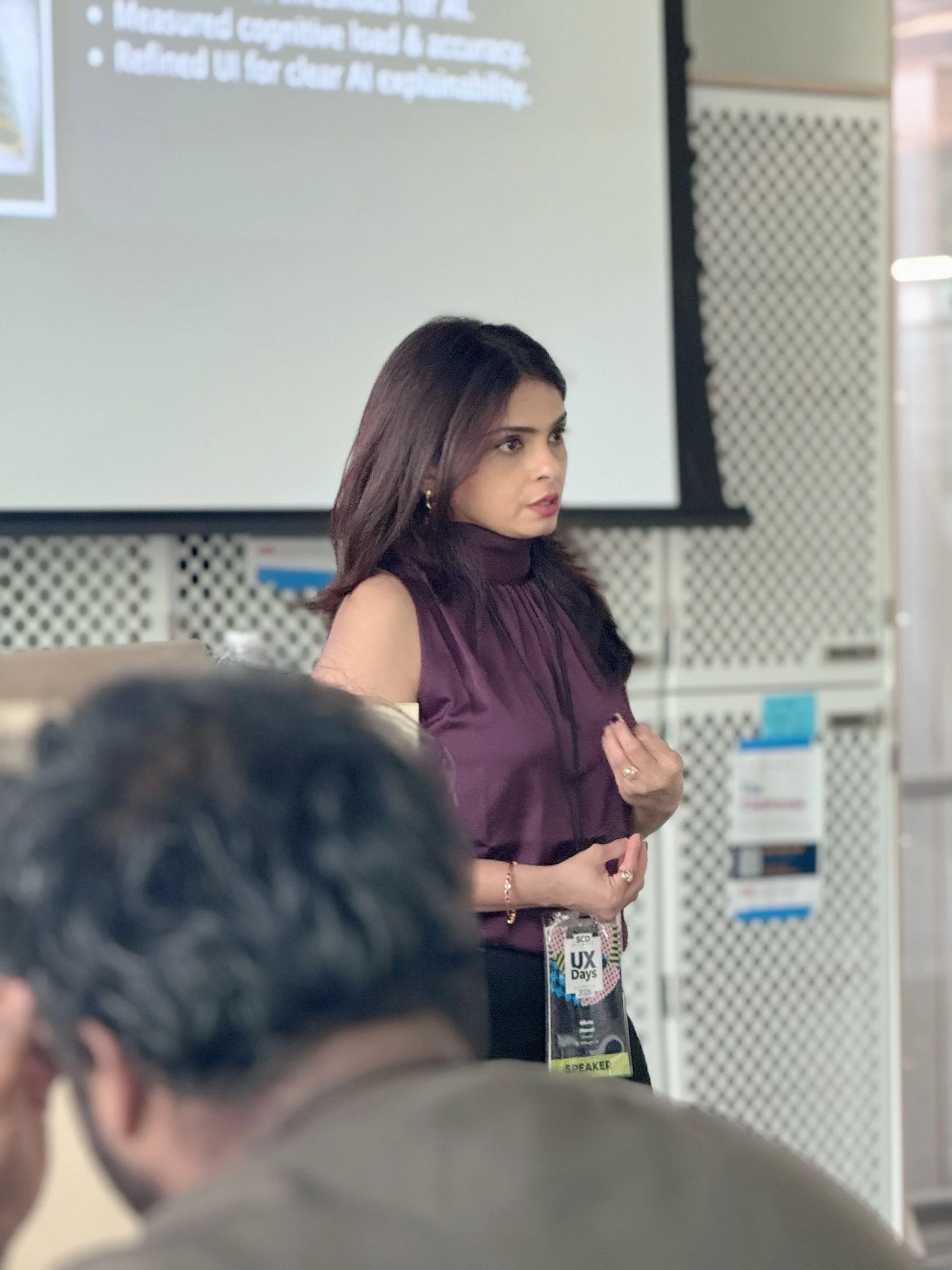 Niketa Jhaveri presenting “The Invisible Decisions Inside AI” at SCD UX Days, exploring AI, research, leadership, and human judgment.