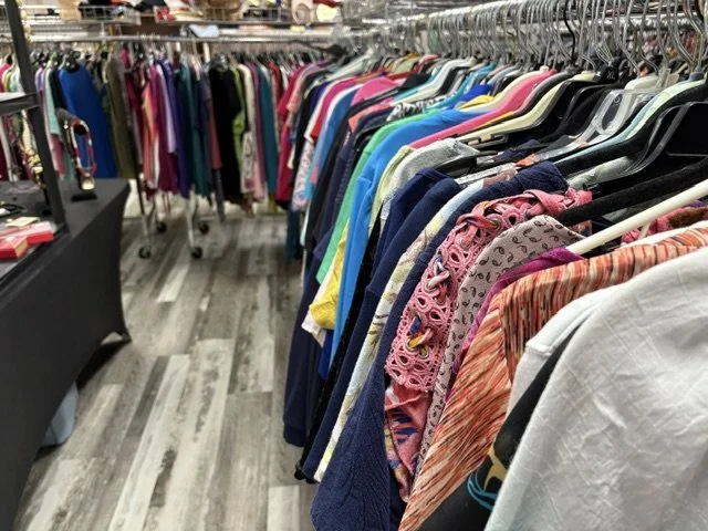 Thrift Store racks of clothes.jpeg