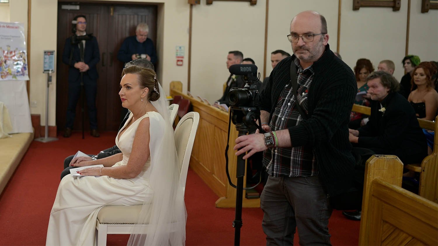 Filming in the Chapel during ceremony.
