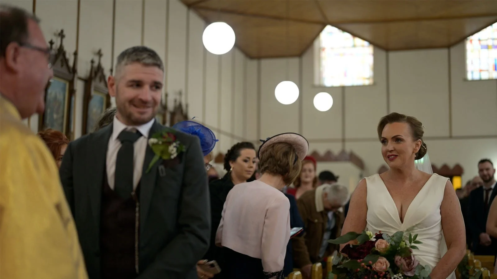  The groom looks slightly around to see the Bride walking up the aisle. 