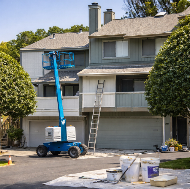 fresh exterior paint unifying new deck and landscaping