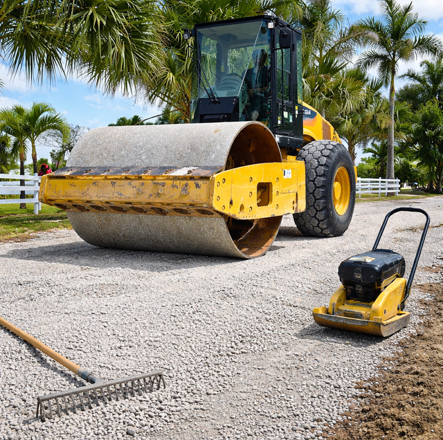 driveway gravel depth test with compactor and measuring tool