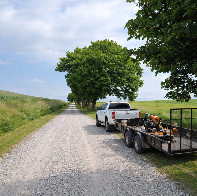 angular recycled concrete rubble on long dirt driveway