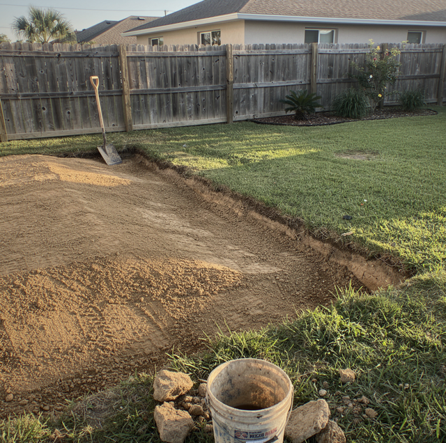 backyard pool after partial demolition with concrete shell remaining