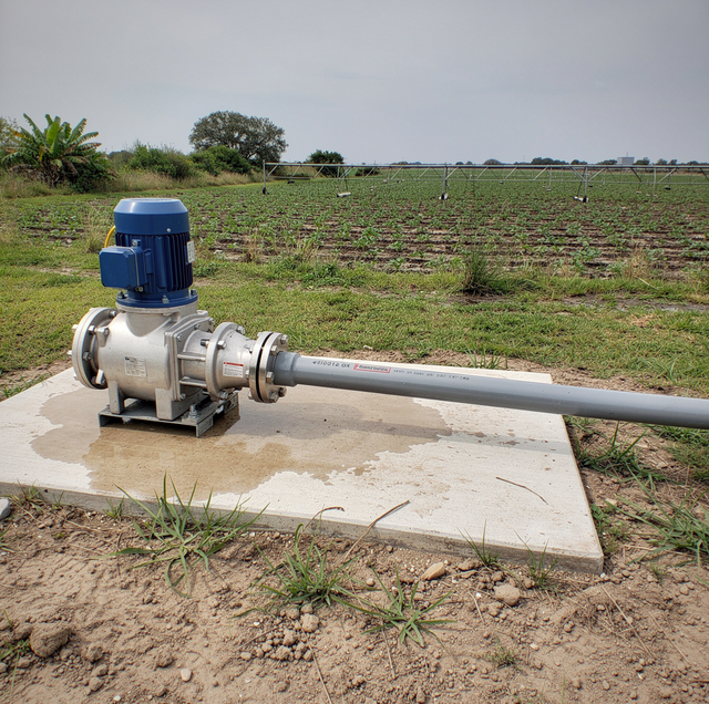 centrifugal pump curve chart beside green field irrigation pipes