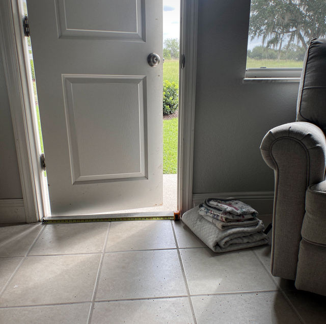 empty dining room holding a single dusty armchair