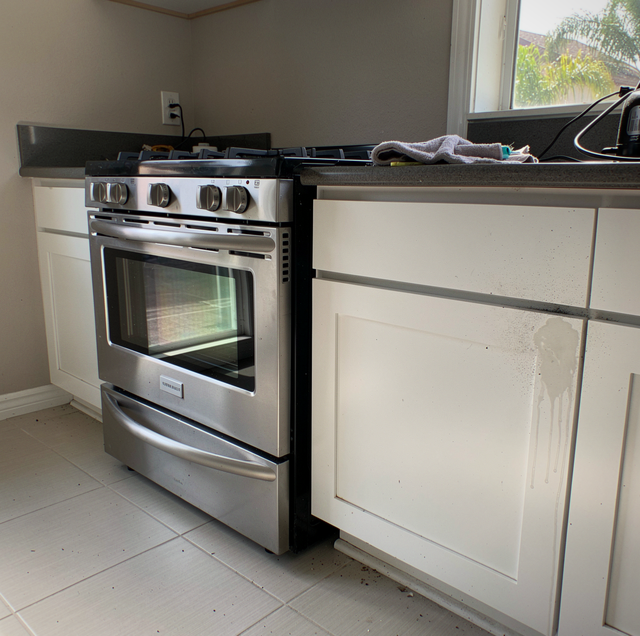 kitchen demolition exposing empty appliance gaps