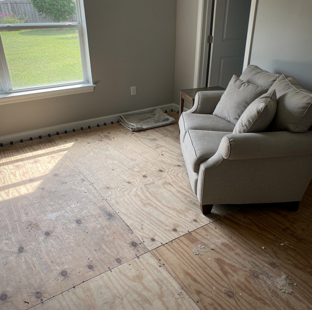 carpet roll pulled up with tack strip exposed
