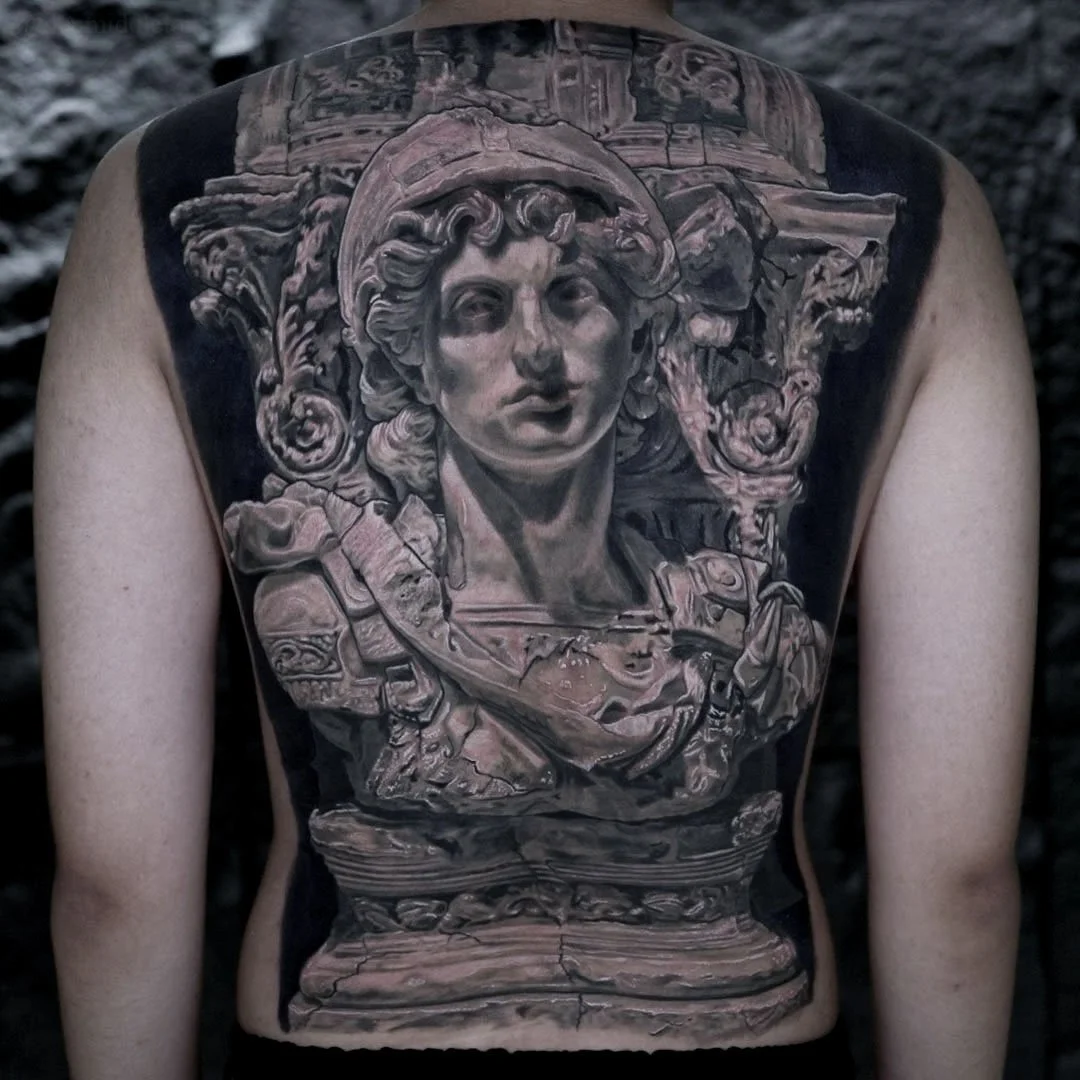 Large scale back tattoo by Glen Middleton featuring an imperial Roman marble bust with classical architectural elements.