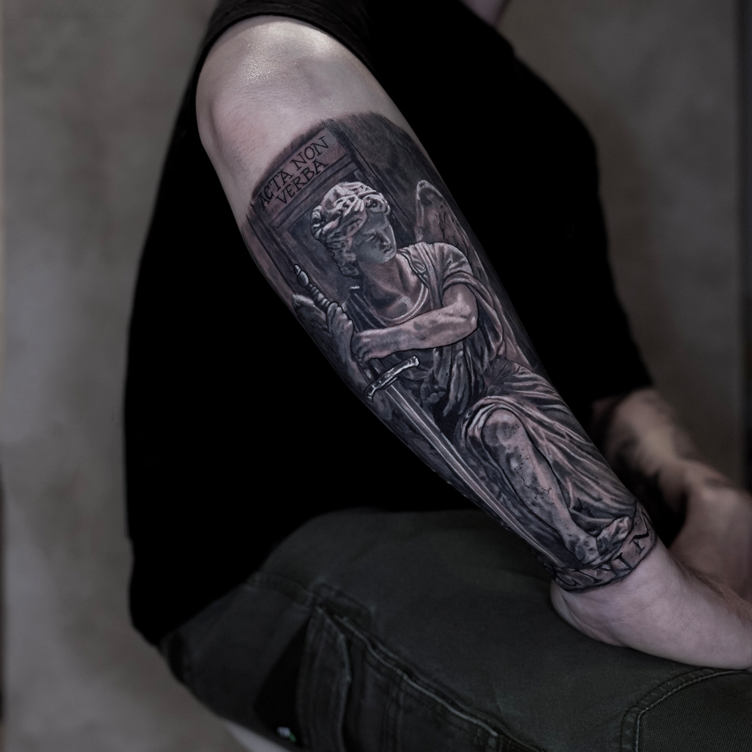 Large scale black and grey sculptural sleeve tattoo by Glen Middleton featuring classical marble realism, dramatic lighting and fine art detailing.
