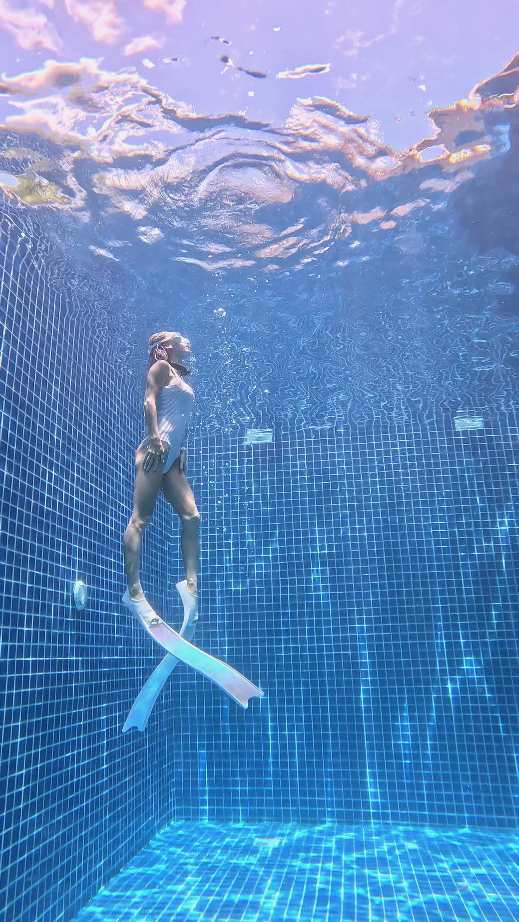 Freediver in a pool with Molchanovs fins