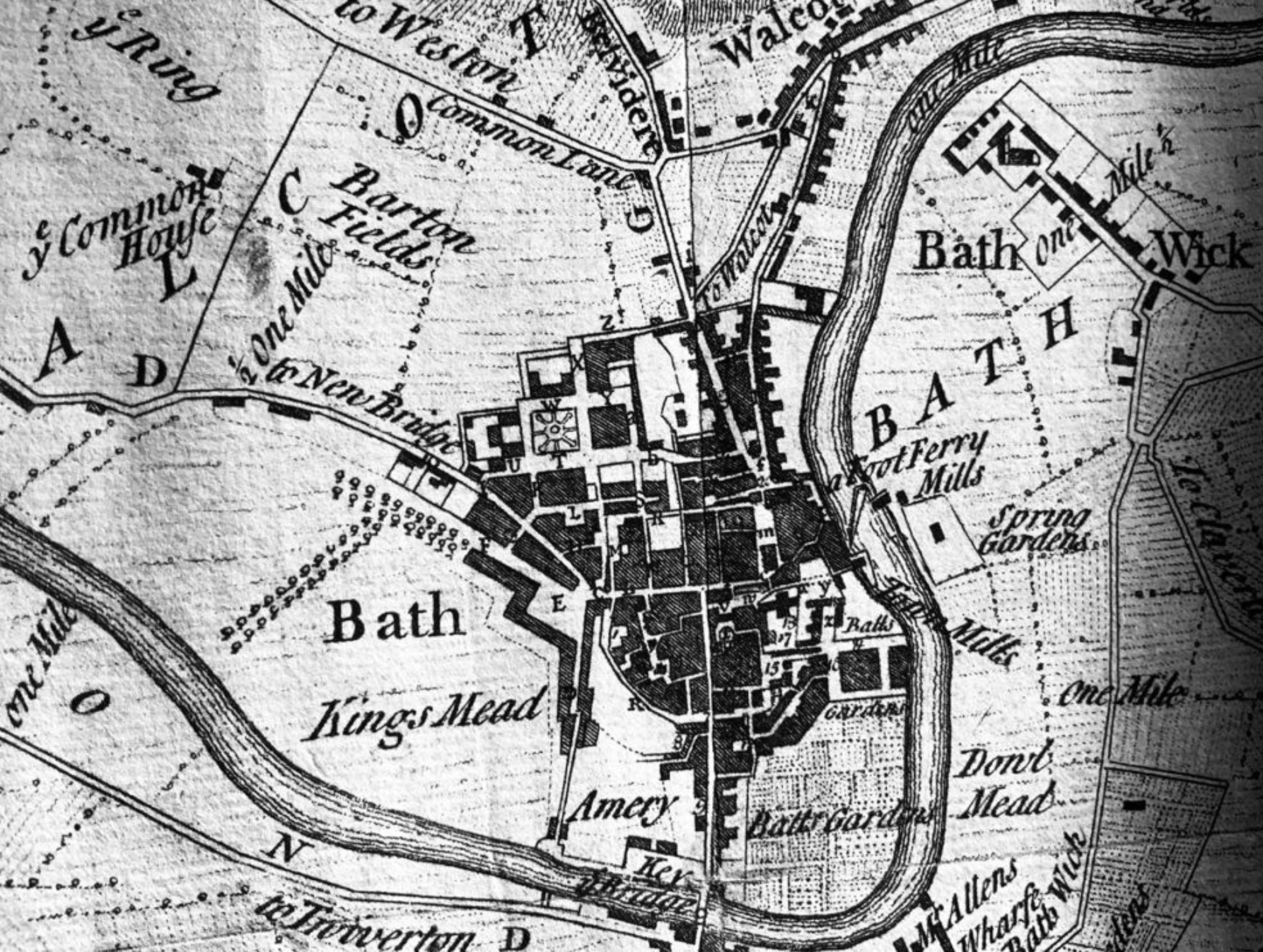 An old black-and-white map of Bath, showing streets, buildings, parks, mills, gardens, and surrounding areas with labels for locations.