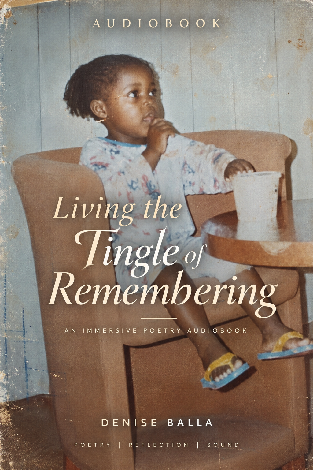 Book cover with a vintage photo of a young girl sitting in a high chair, eating from a cup, with a contemplative expression, set against a textured background. The text reads "Living the Tingle of Remembering" by Denise Balla.