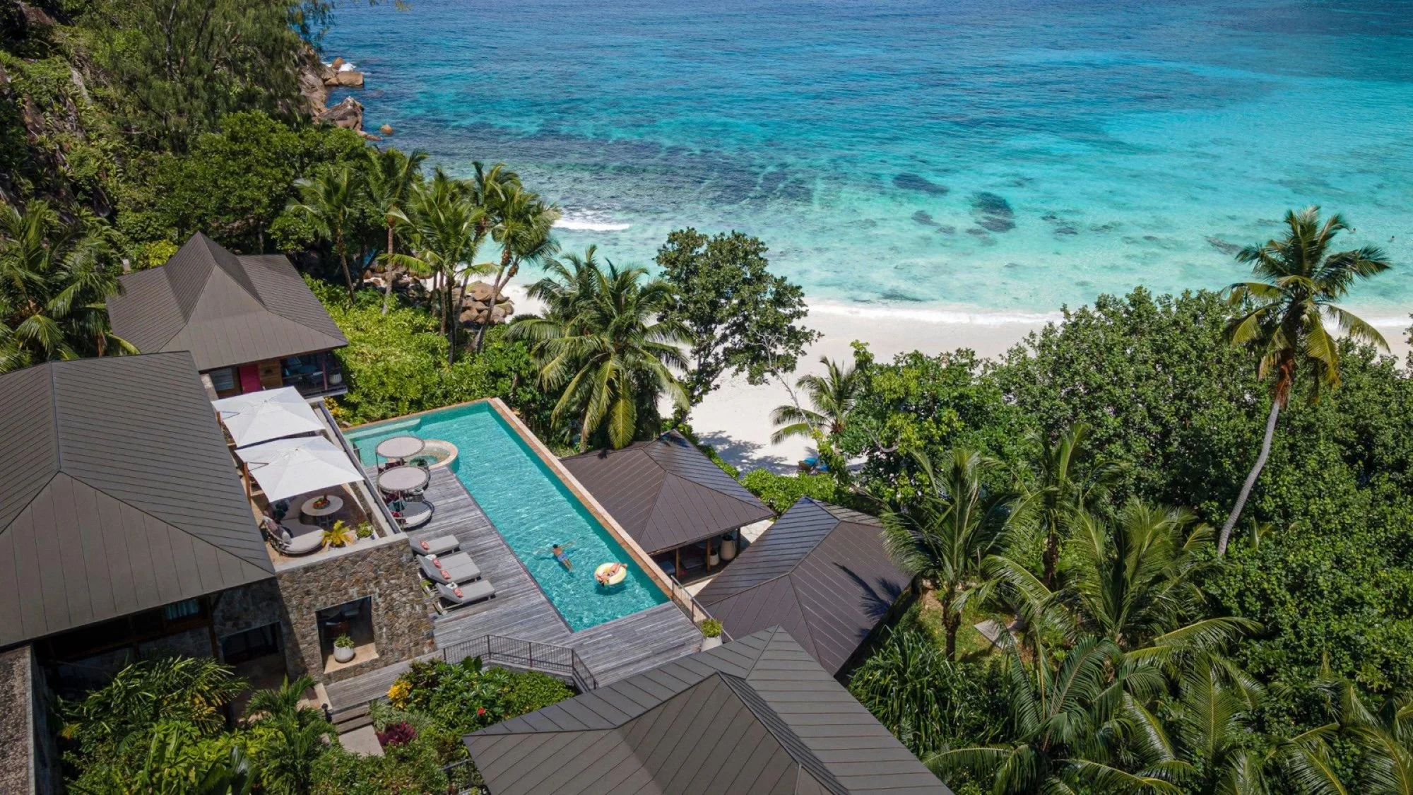 Private villa pool at Four Seasons Resort Seychelles overlooking the bay