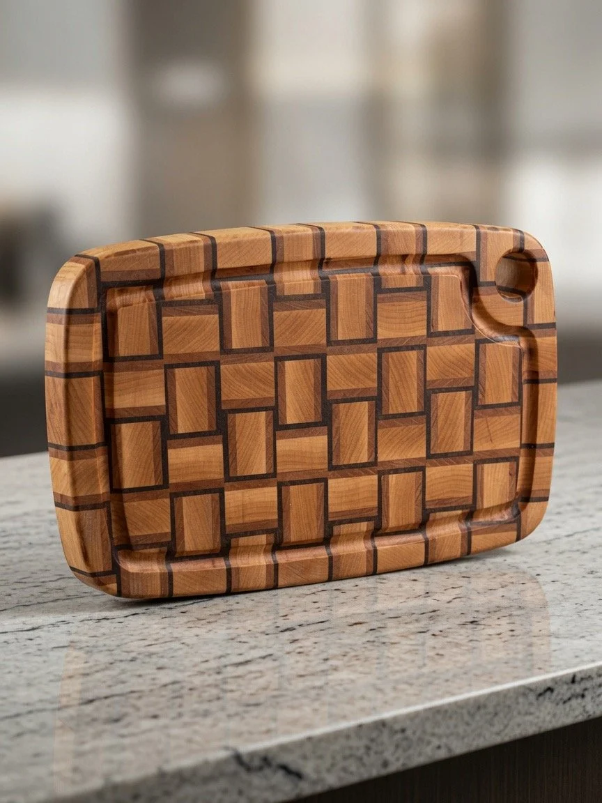 Wooden serving tray with geometric pattern, rounded edges, and a small circular cutout in the top right corner, placed on a granite countertop.