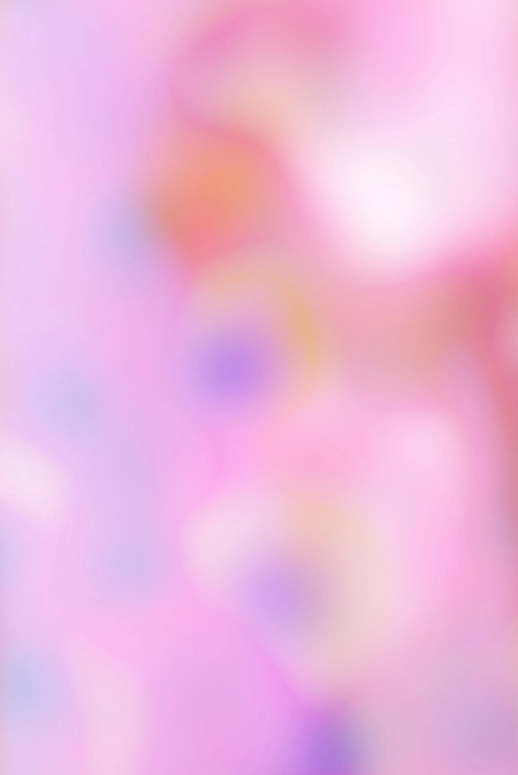 Blurred pink and purple pastel background with soft light effects.