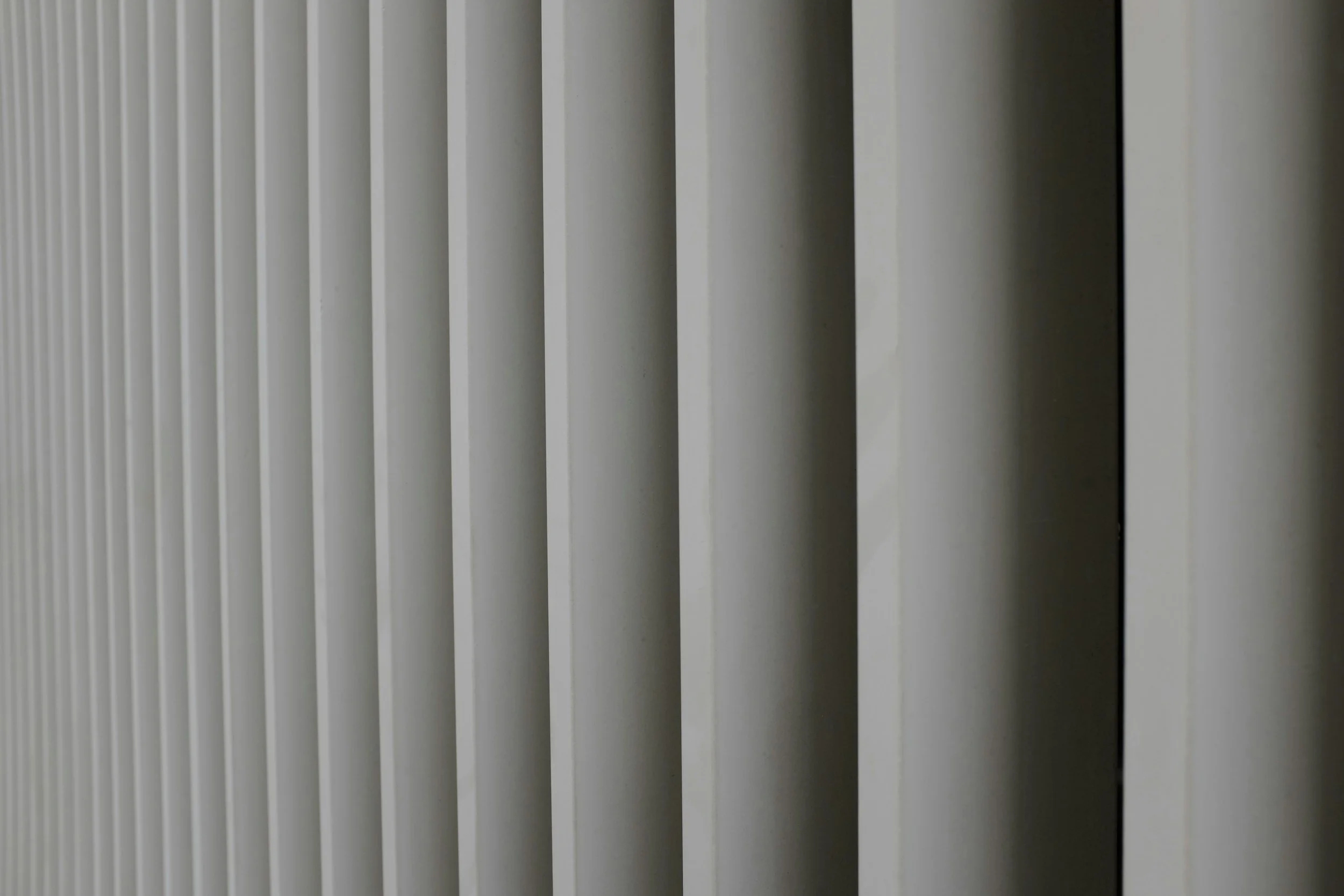 Vertical Blinds — An excellent solution for larger windows, bi-fold doors, patio doors and commercial environments. The adjustable louvres provide excellent control over privacy and natural light while maintaining a sleek, contemporary appearance. Id