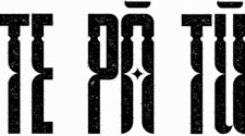Close-up of stylized black lettering or symbols on a white background.