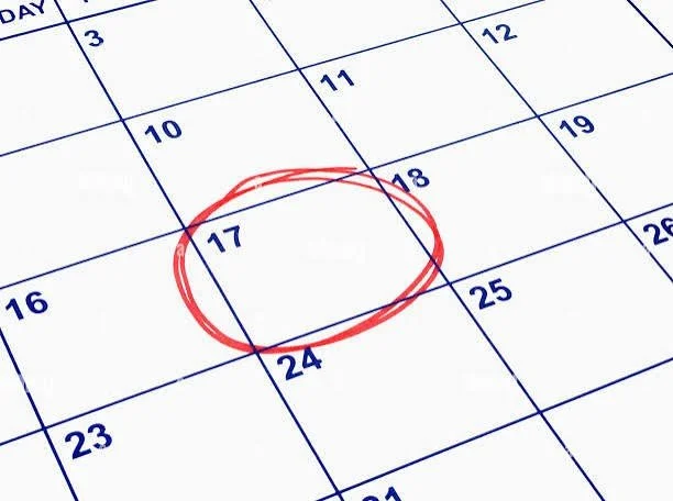 A close-up of a calendar with the date 17 circled in red ink.