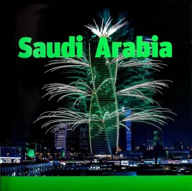 Fireworks display over a city skyline with the text 'Saudi Arabia' in bright green letters.