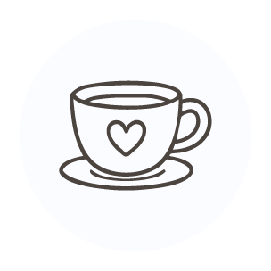A coffee cup with a heart on it on a saucer