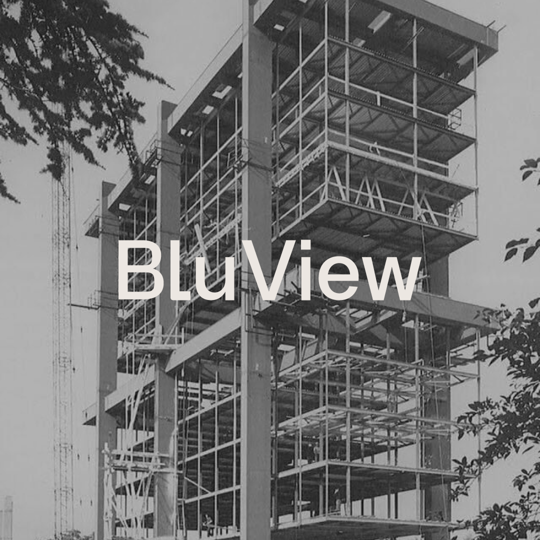 Under construction building with steel framework and scaffolding