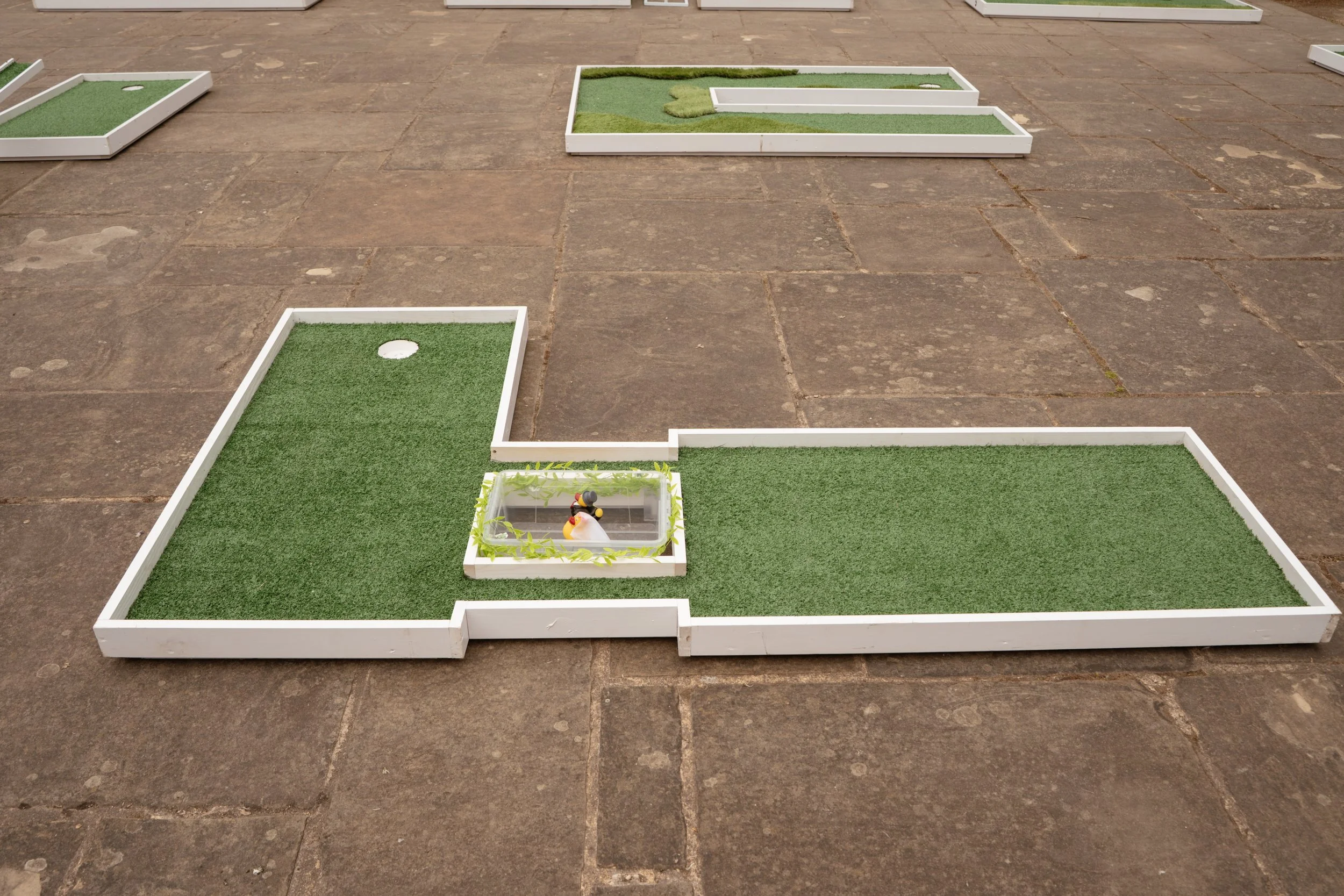Premium outdoor games collection by Social Set, including mini golf, Giant Jenga, Giant Connect Four, Cornhole, Ring Toss, Dominoes and Noughts & Crosses for event hire.