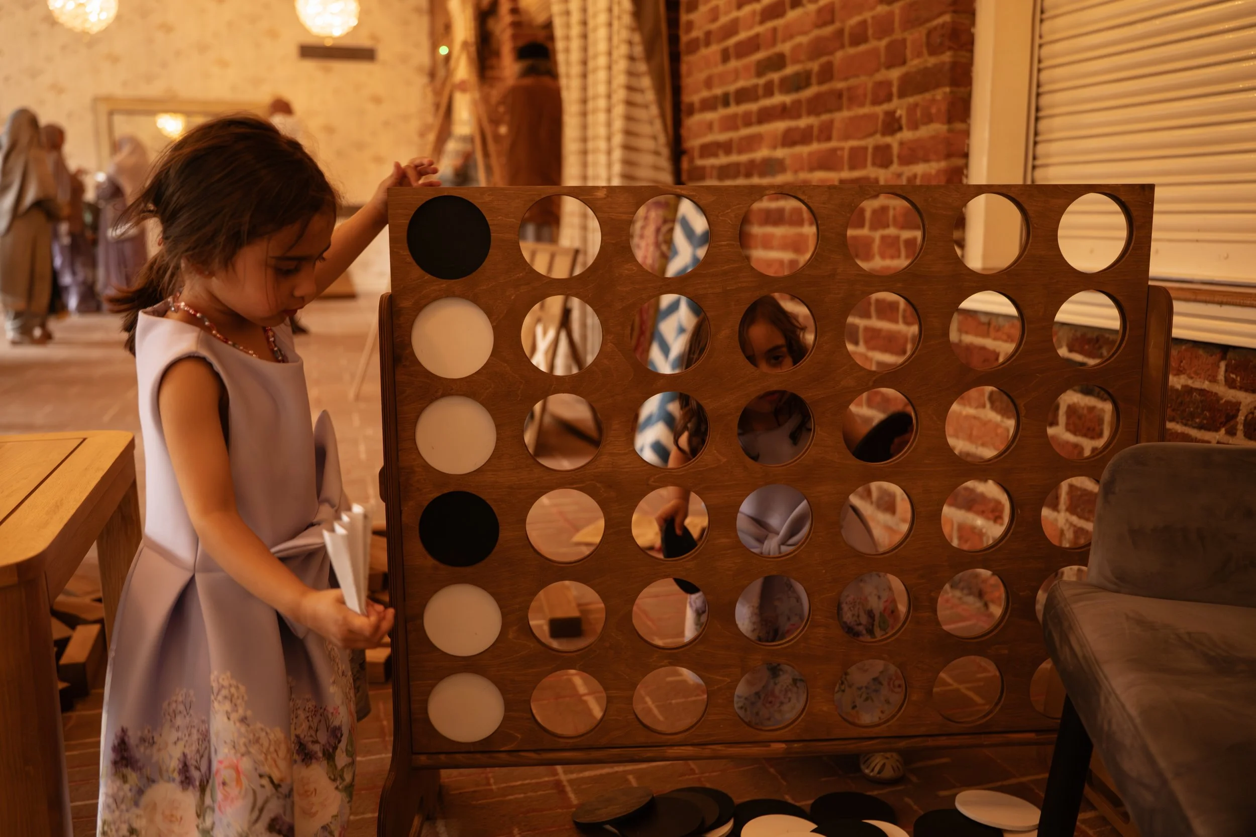 Premium outdoor games collection by Social Set, including mini golf, Giant Jenga, Giant Connect Four, Cornhole, Ring Toss, Dominoes and Noughts & Crosses for event hire.