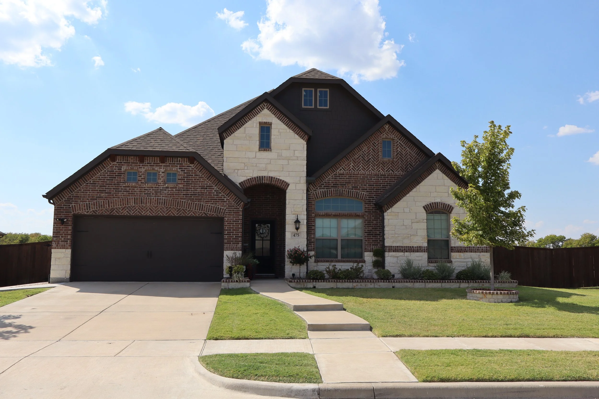 Brick and stone home in The Meadows of Morgan Creek in Royse City, Texas