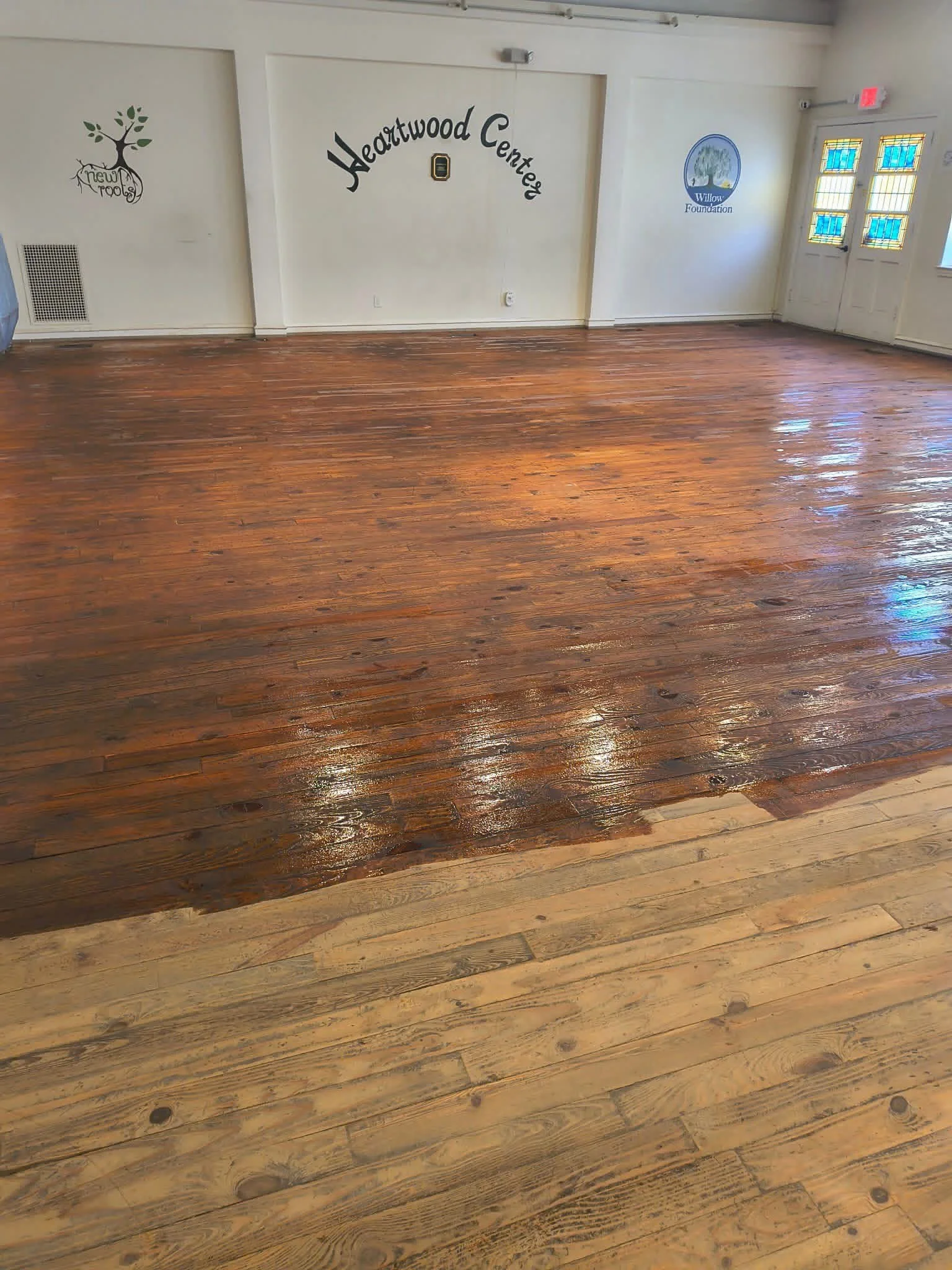 Keystone Job Corps Refinishing the Heartwood Center Floors. Photo by Mandi. 