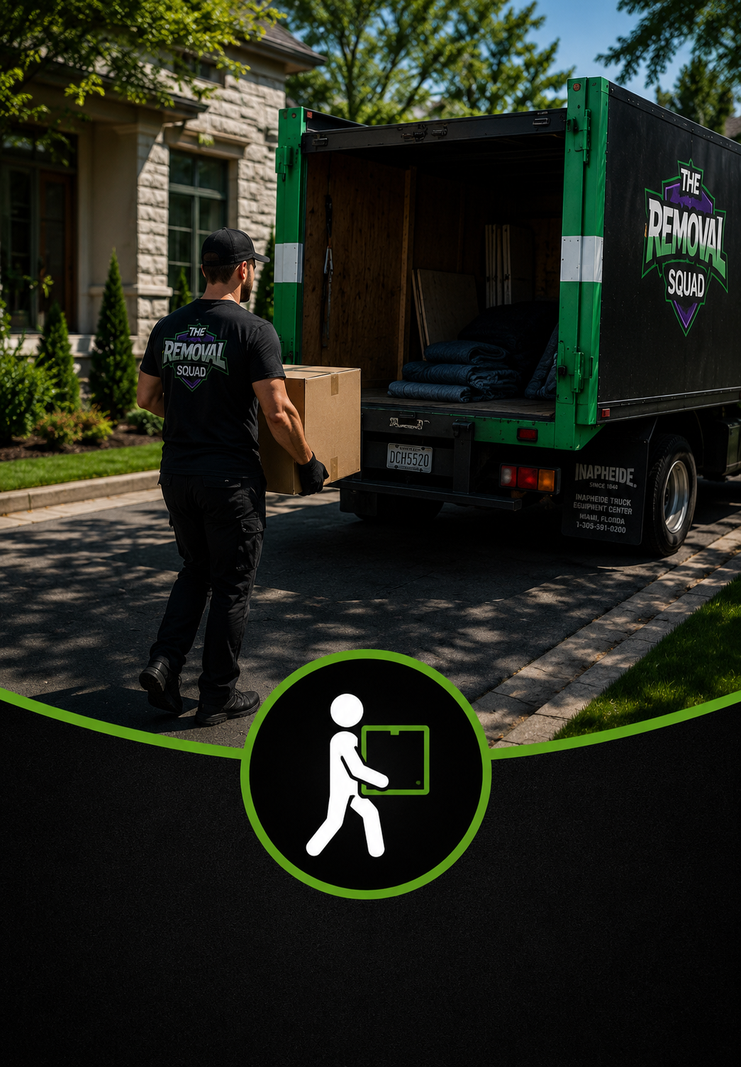 A worker from the Removal Squad loading a box into a moving truck parked on a residential street with a stone house and green trees in the background.