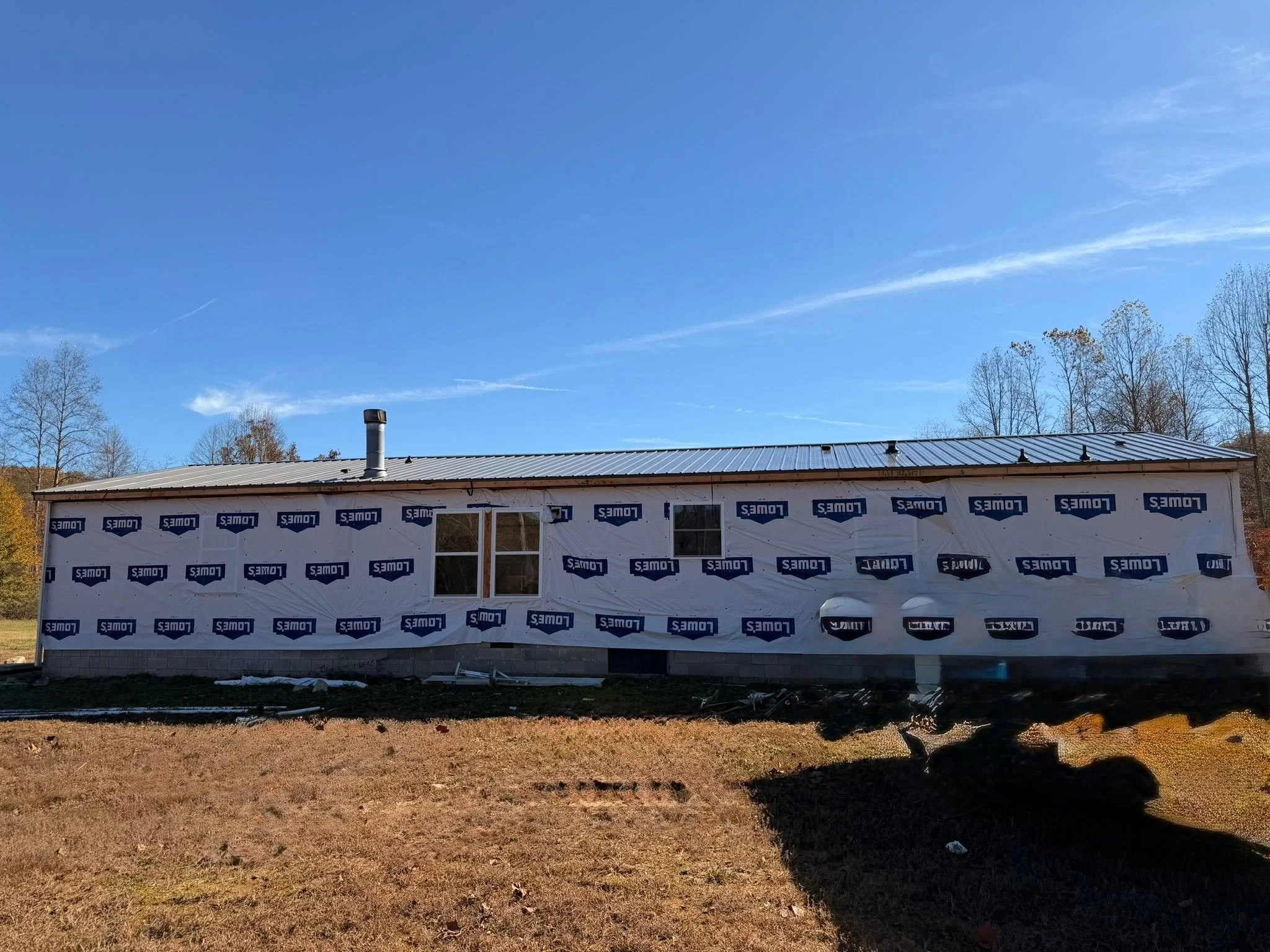 New home prepared for vinyl siding installation by Modern Edge Builders in Western North Carolina.