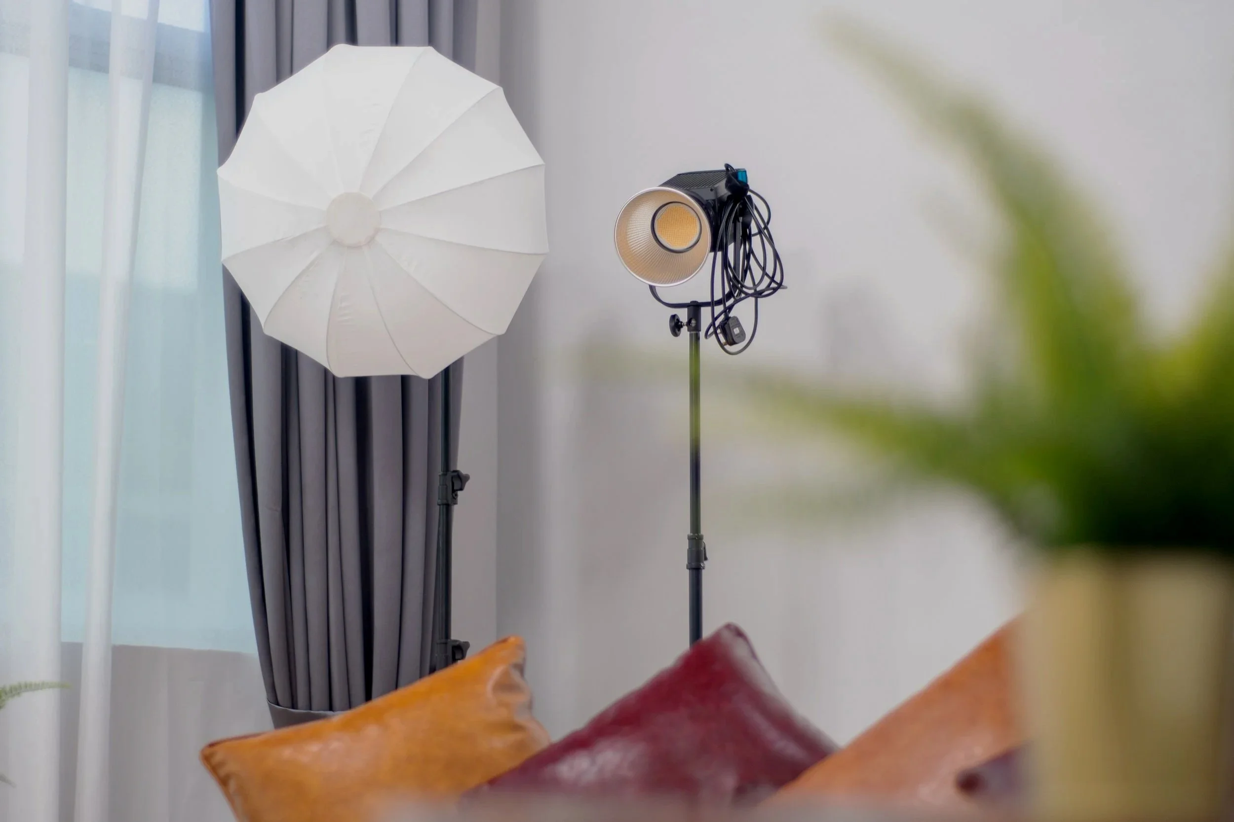 Photography equipment, including a softbox and a studio light setup in Gratias Studio.