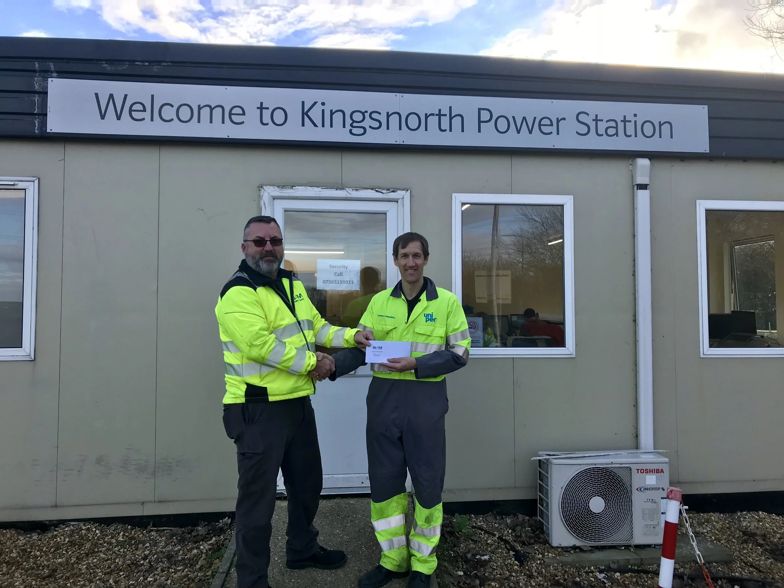 Calum handing over finished H&S File to Project Director