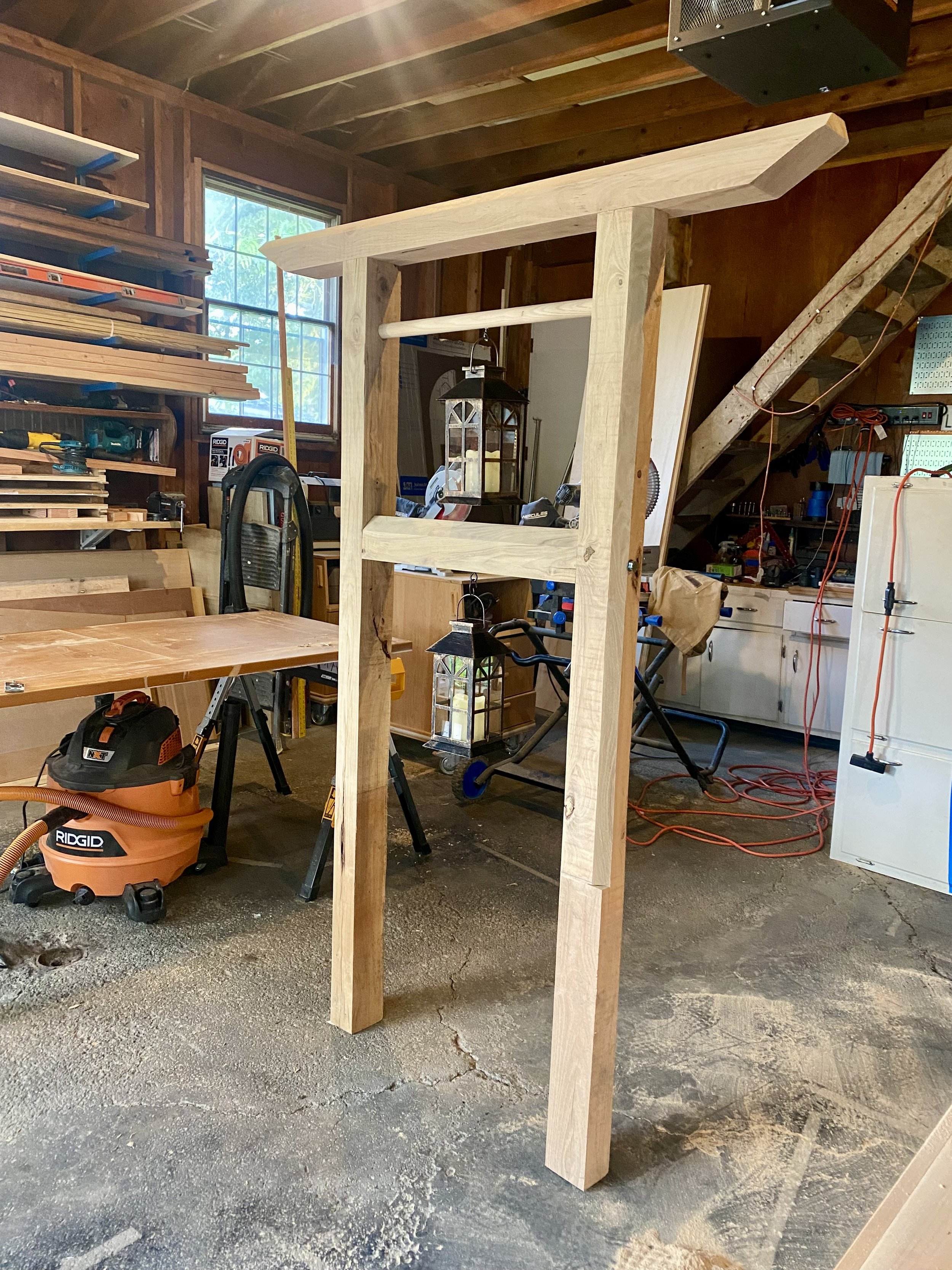 A wooden japandi inspired sign with traditional joinery in a wood shop.