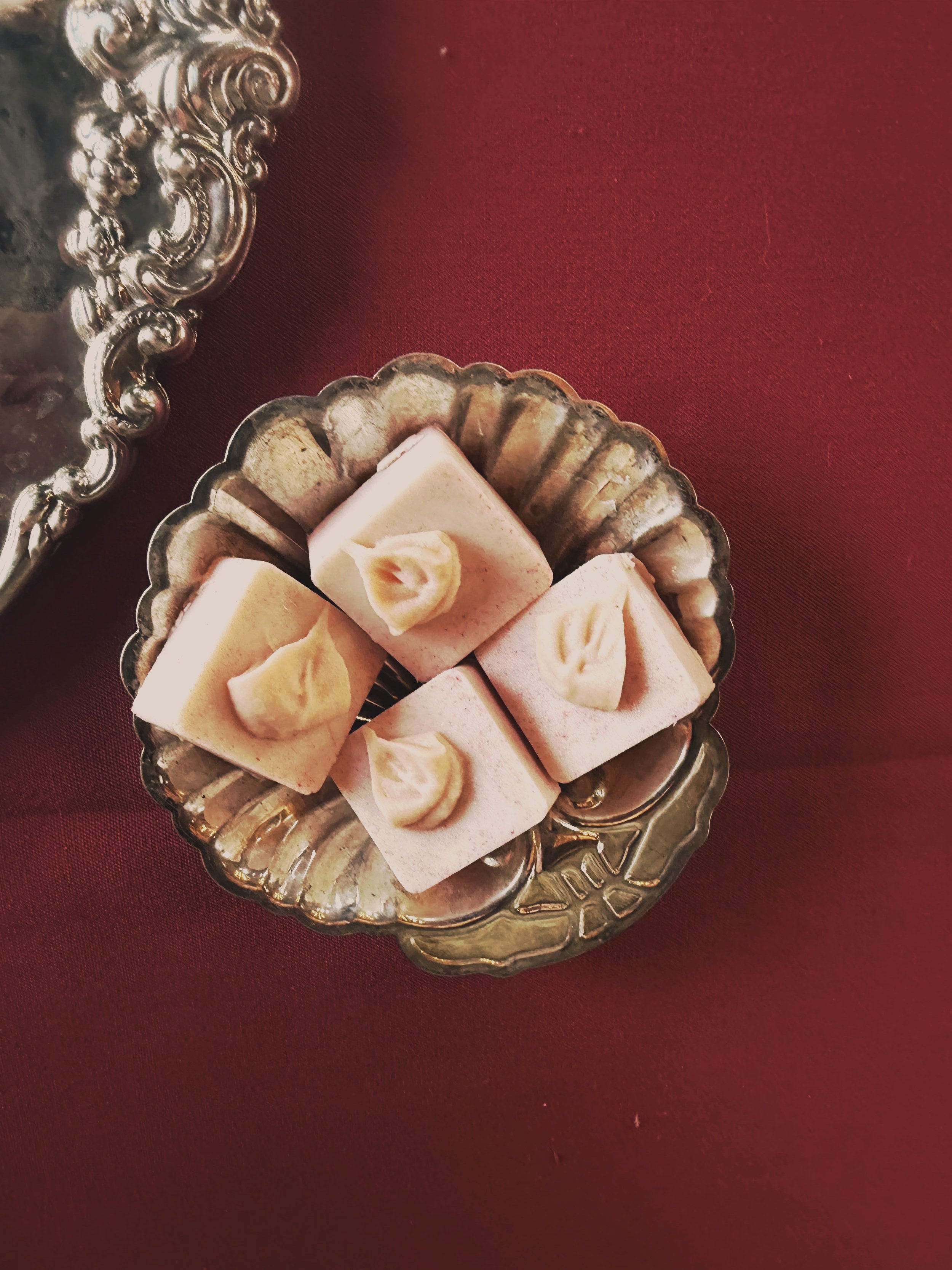 Silver shell tray with guava petit fours