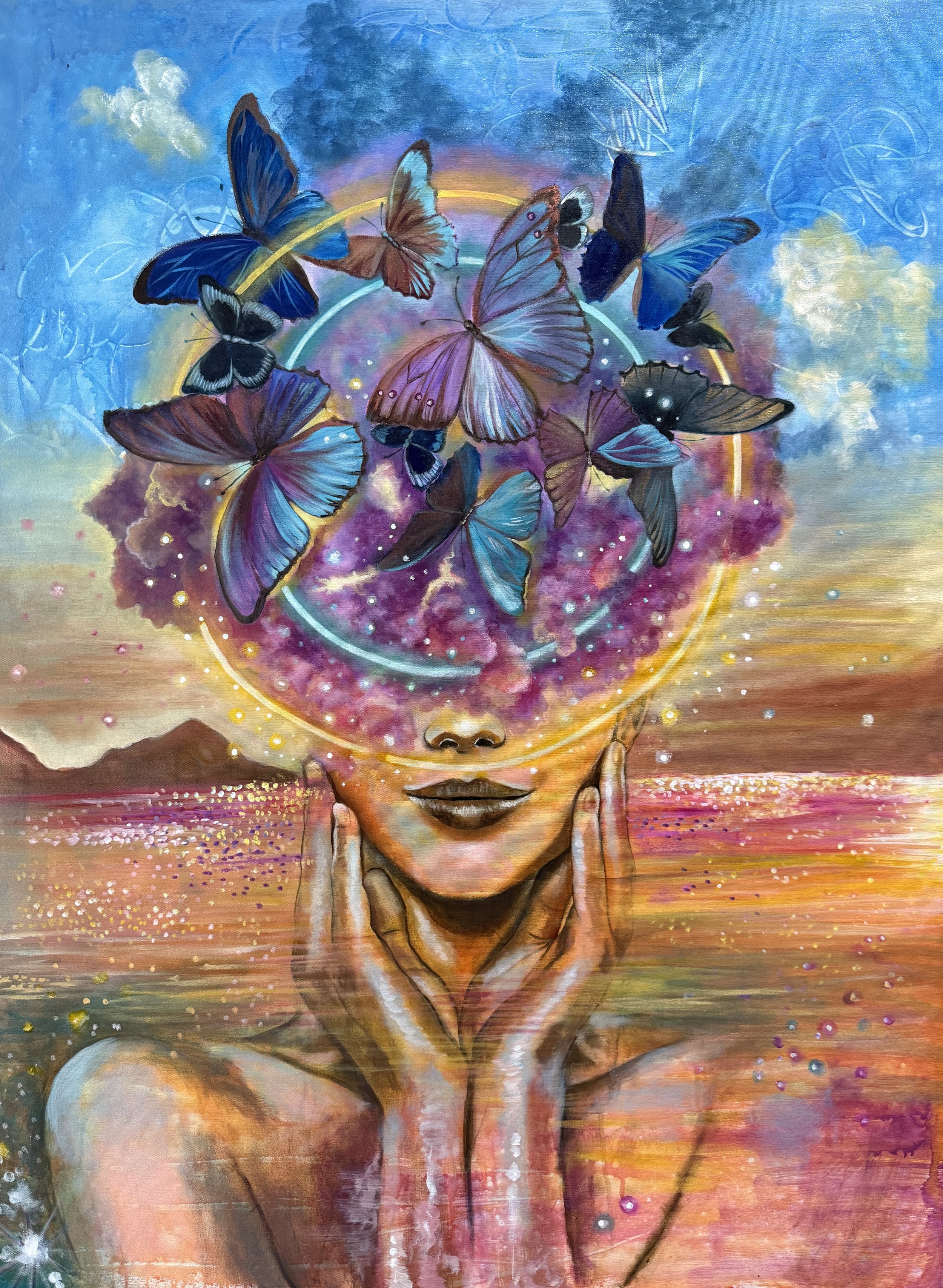 A surreal painting of a woman with butterflies appearing from her head, which is depicted as a cosmic, colorful space. The woman has her eyes closed and fingers on her temples, with a sunset or sunrise background over a body of water.