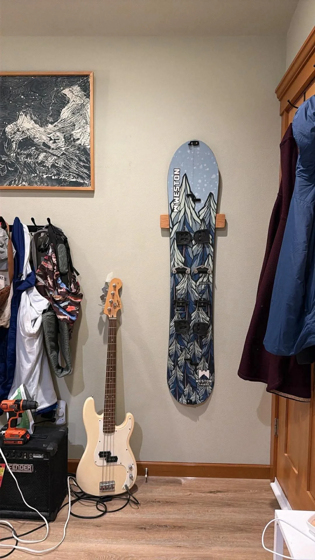 Snowboard mounted on a Method Mount™ in a residential entryway